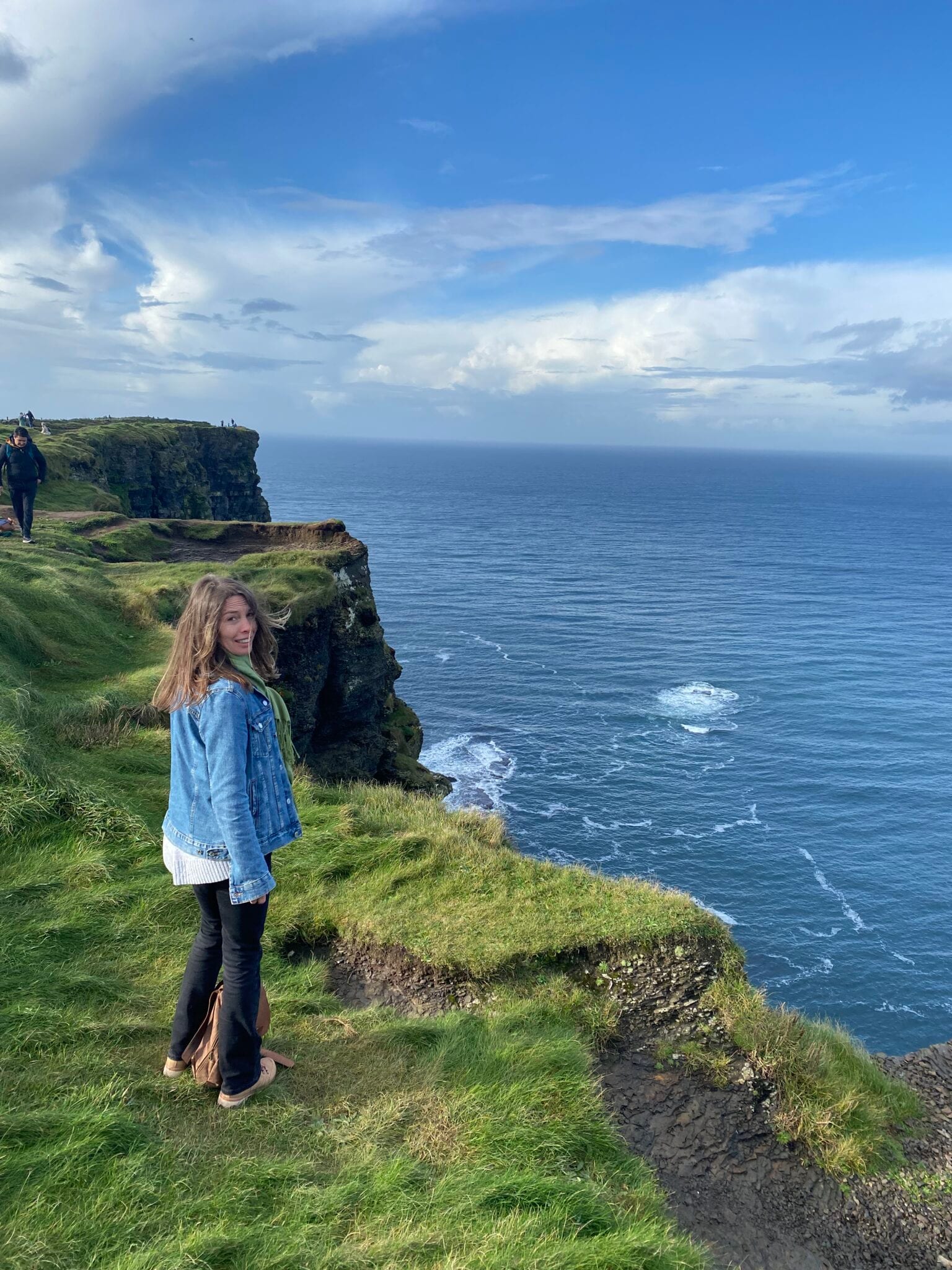 Kristen J. Tsetsi standing on the Cliffs of Moher